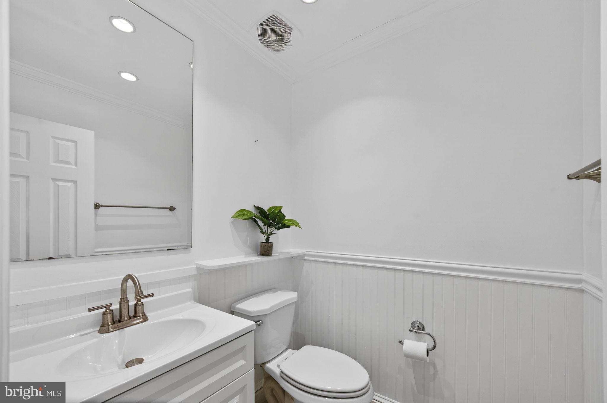10600 Vantage Court Potomac, MD 20854 - Photo 21 of 91 a white toilet sitting next to a bathroom sink