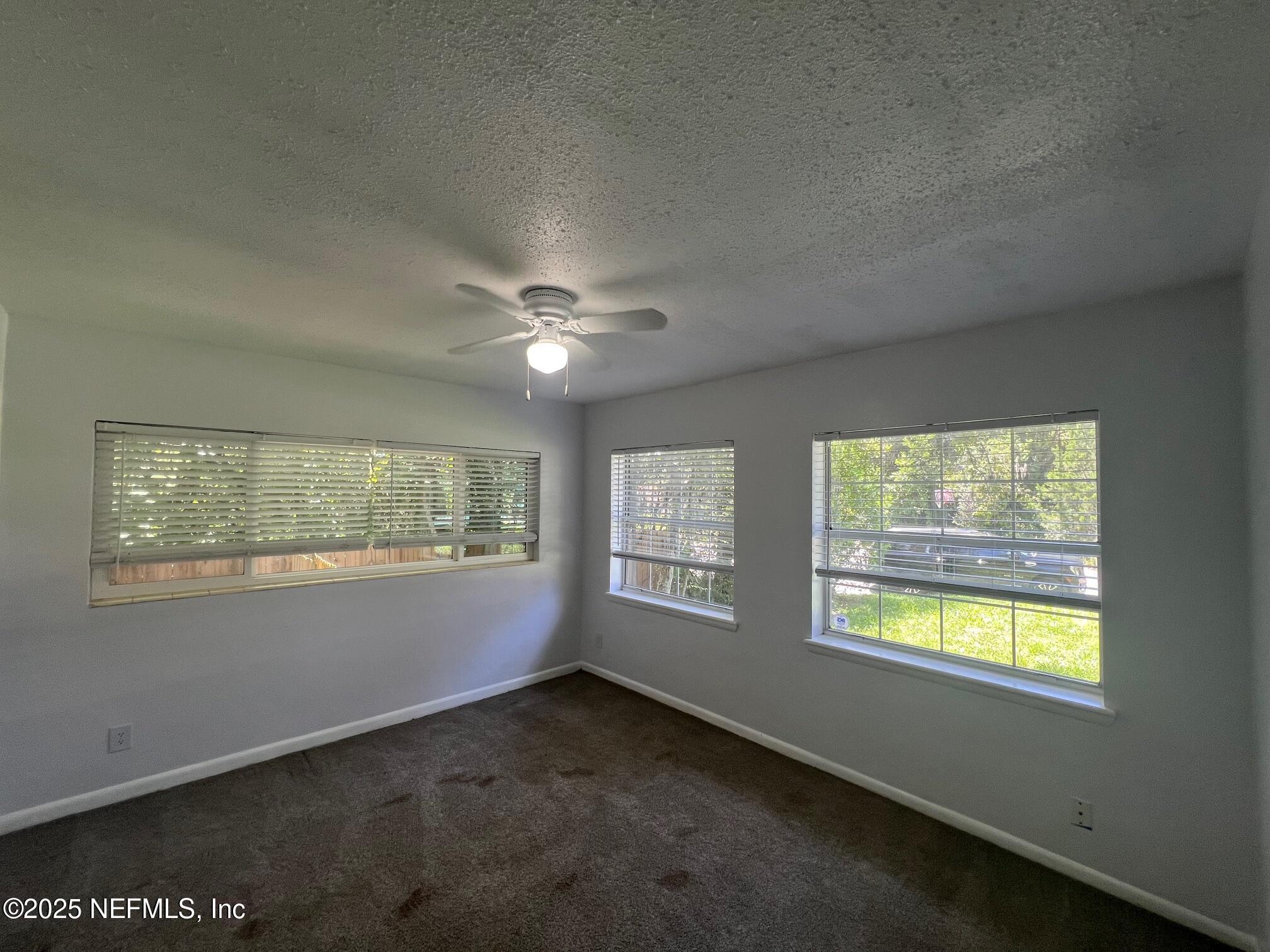 6231 Riviera Manor Drive Jacksonville, FL 32216 - Photo 14 of 15 a view of an empty room and window