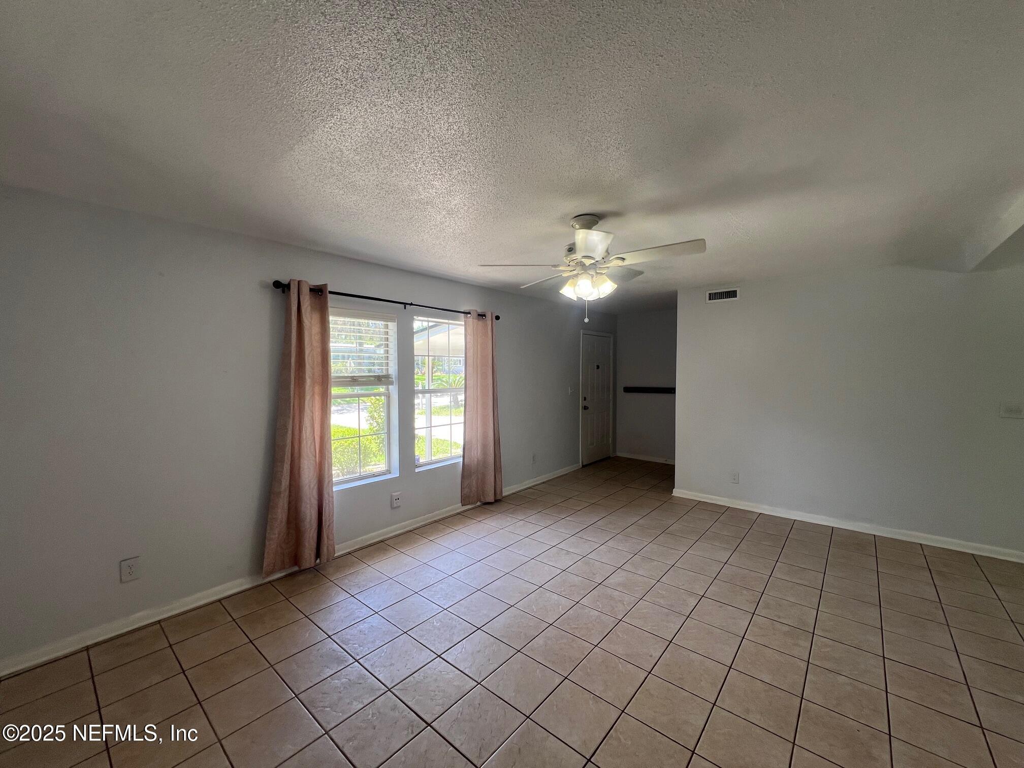 6231 Riviera Manor Drive Jacksonville, FL 32216 - Photo 7 of 15 a view of an empty room with a window
