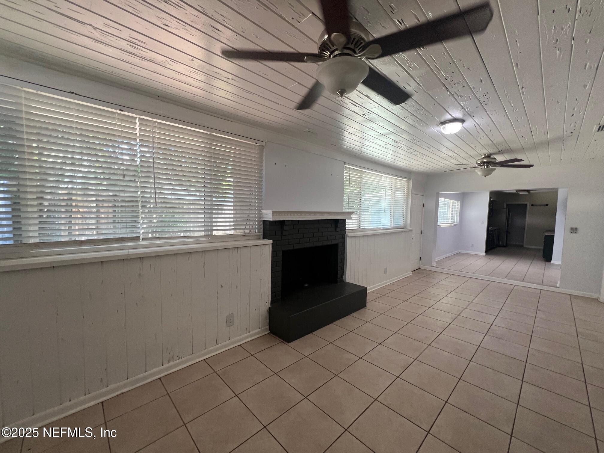 6231 Riviera Manor Drive Jacksonville, FL 32216 - Photo 10 of 15 a living room with furniture and a fireplace