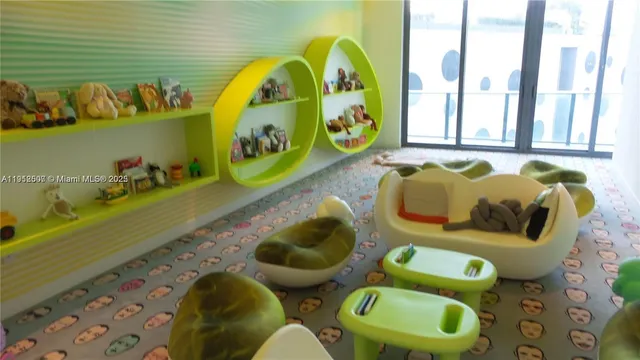 a bathroom with a sink mirror and toilet