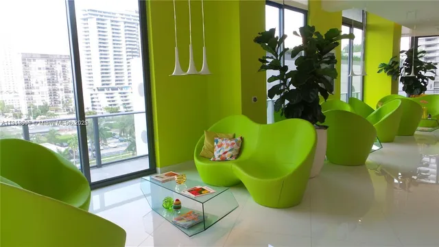 a room with green walls and a large window