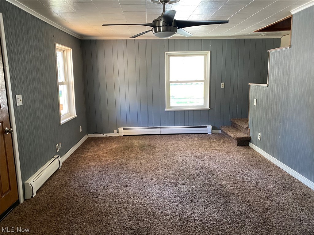 235 Ridge Street Leetonia, OH 44431 - Photo 5 of 15 natural light, ceiling fan and crown molding.