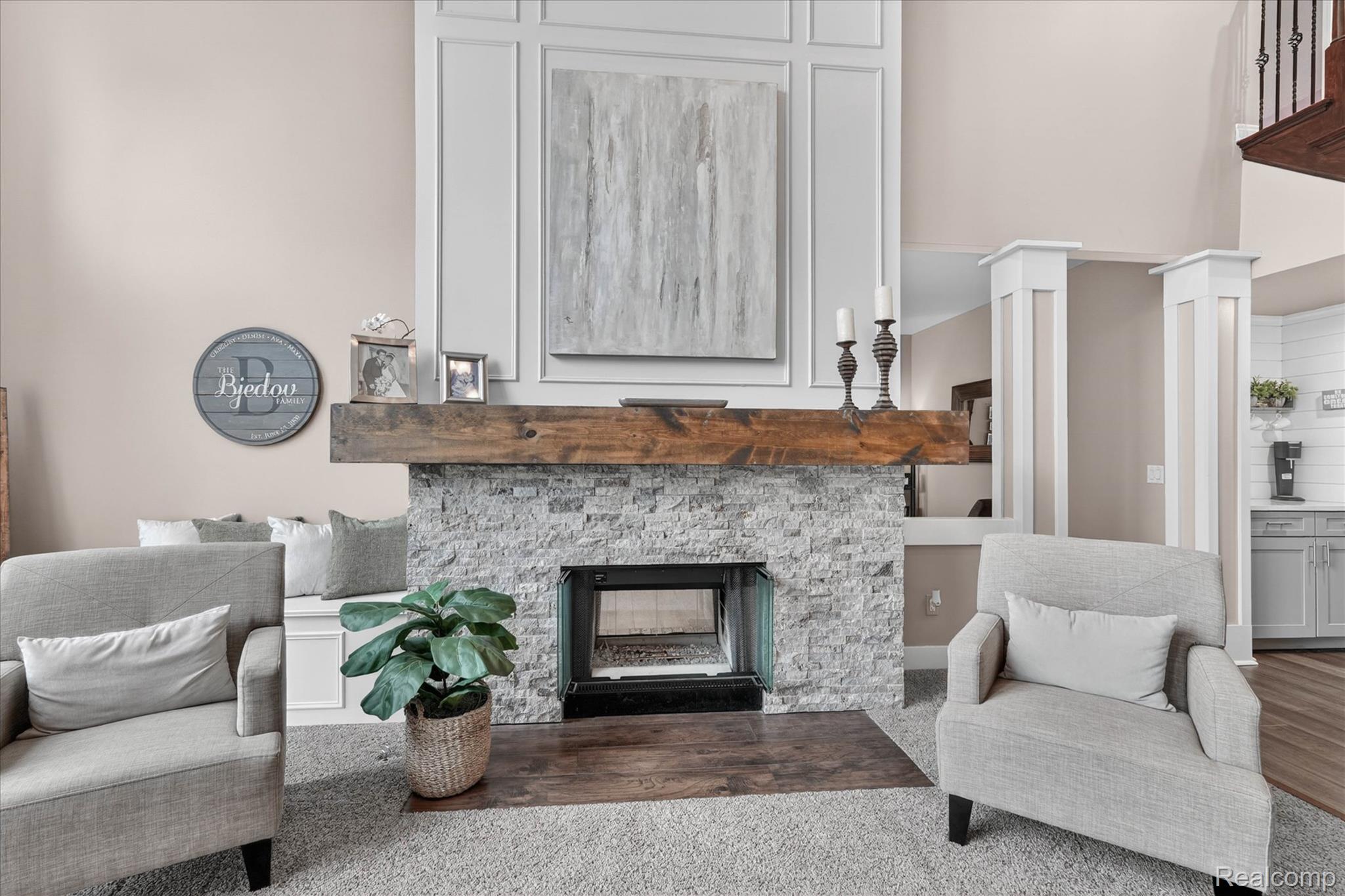 9074 Ridgefield Drive Brighton, MI 48114 - Photo 6 of 75 Sitting room with a stone fireplace and a high ceiling