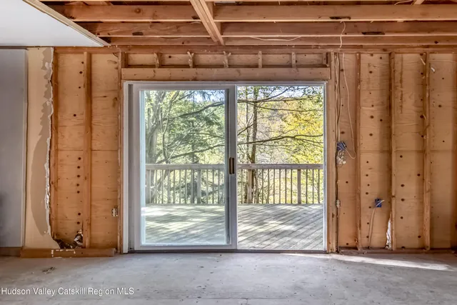 a view of backyard with large trees