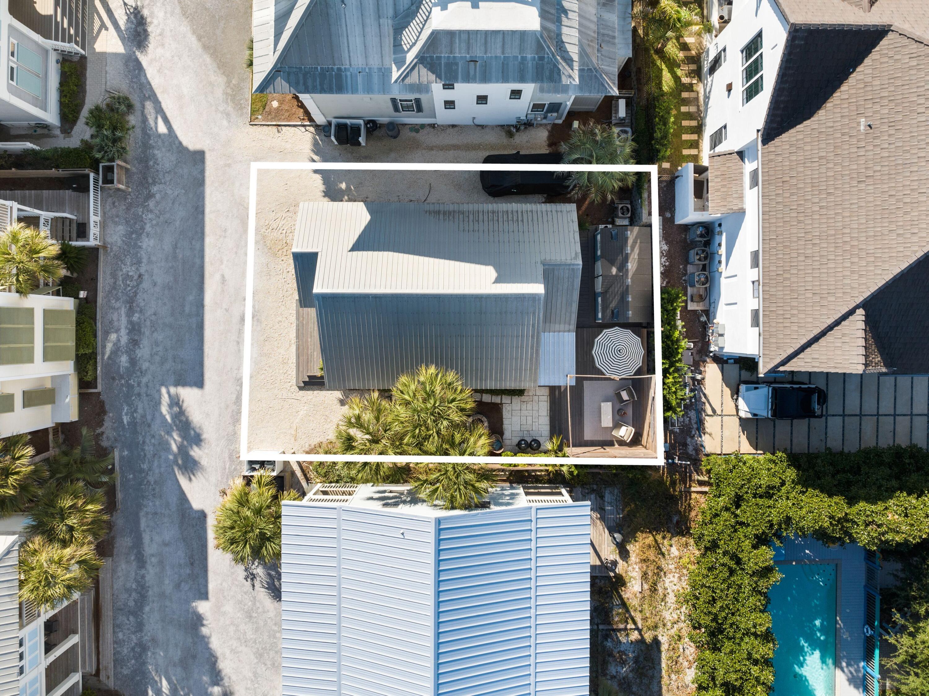 50 Cottage Street Santa Rosa Beach, FL 32459 - Photo 11 of 54 a view of swimming pool with outdoor seating and plants