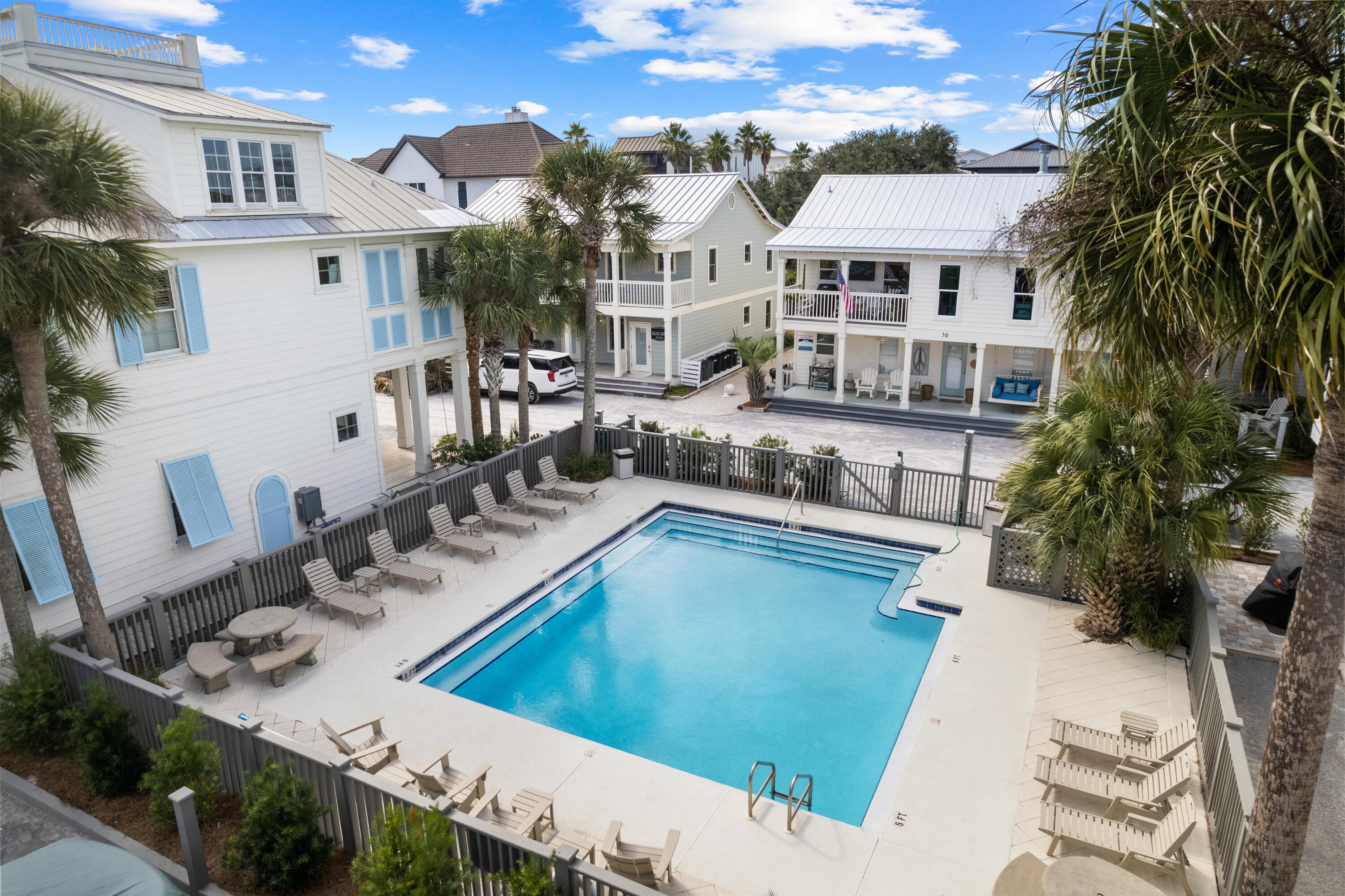 50 Cottage Street Santa Rosa Beach, FL 32459 - Photo 14 of 54 a view of a house with pool and chairs