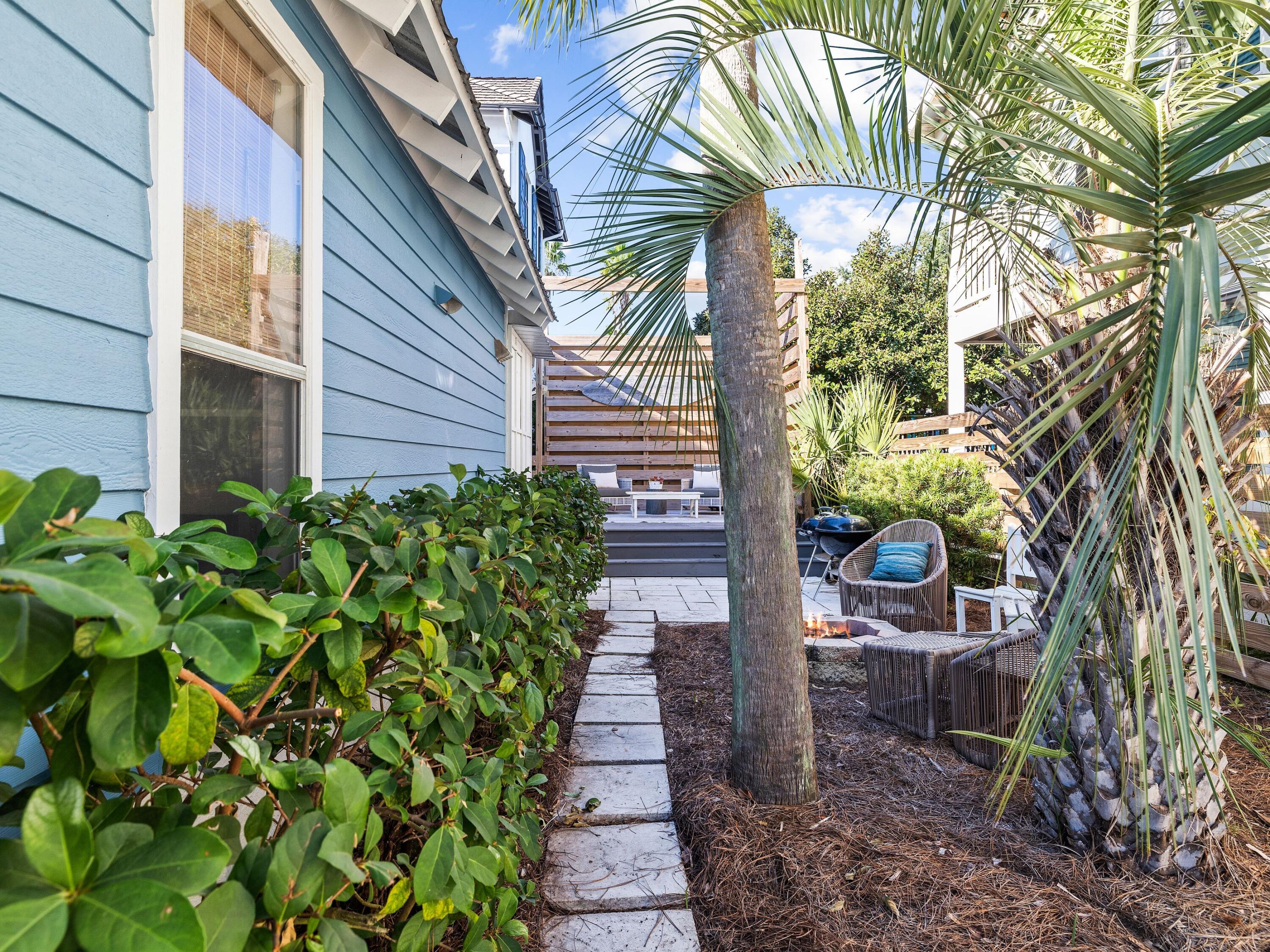 50 Cottage Street Santa Rosa Beach, FL 32459 - Photo 15 of 54 a view of a pathway with plants and large trees