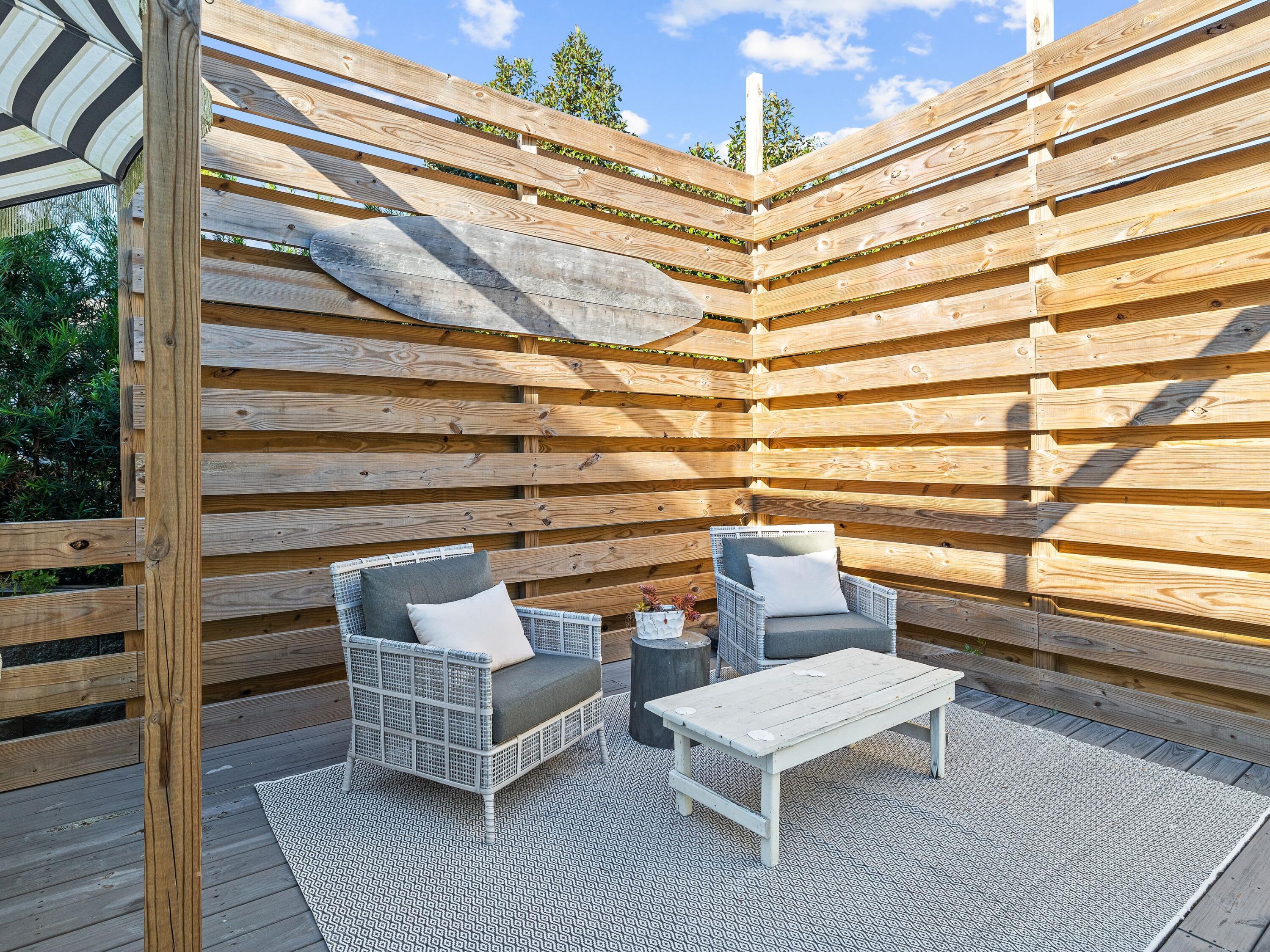 50 Cottage Street Santa Rosa Beach, FL 32459 - Photo 20 of 54 a roof deck with couch and chairs
