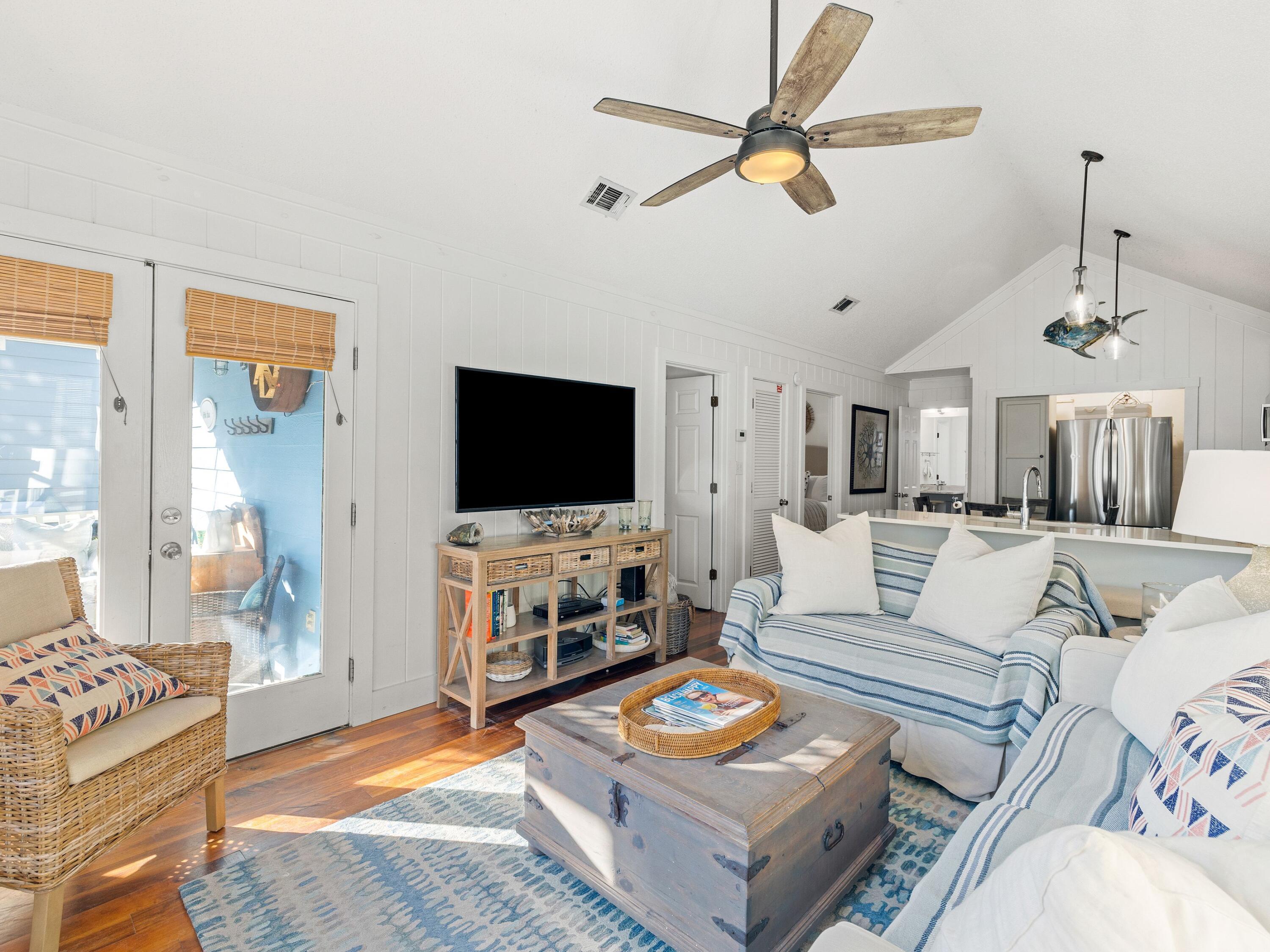 50 Cottage Street Santa Rosa Beach, FL 32459 - Photo 24 of 54 a living room with furniture and a flat screen tv