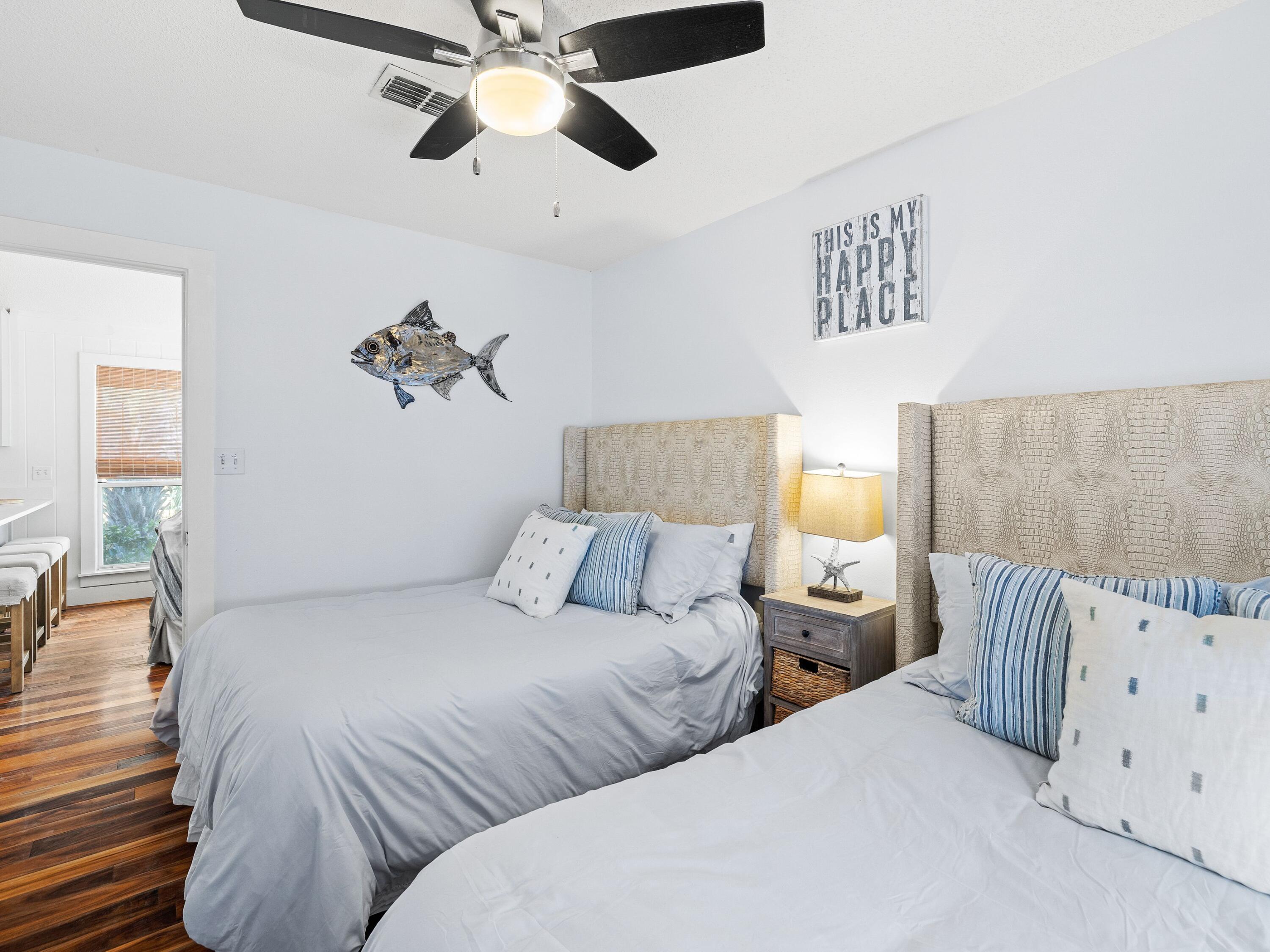 50 Cottage Street Santa Rosa Beach, FL 32459 - Photo 33 of 54 a bedroom with two beds and painted walls