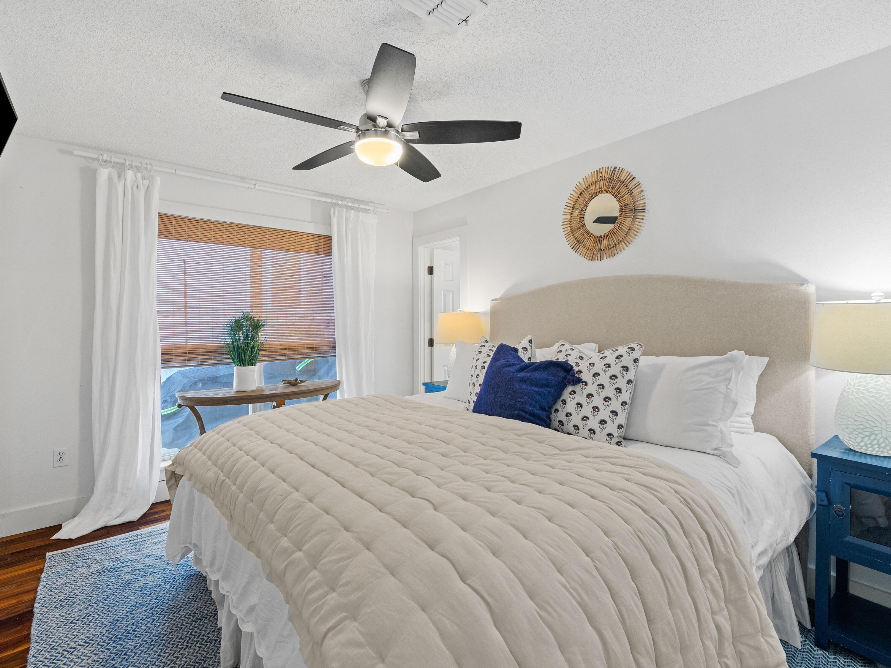 50 Cottage Street Santa Rosa Beach, FL 32459 - Photo 34 of 54 a bed room with a bed and a chandelier