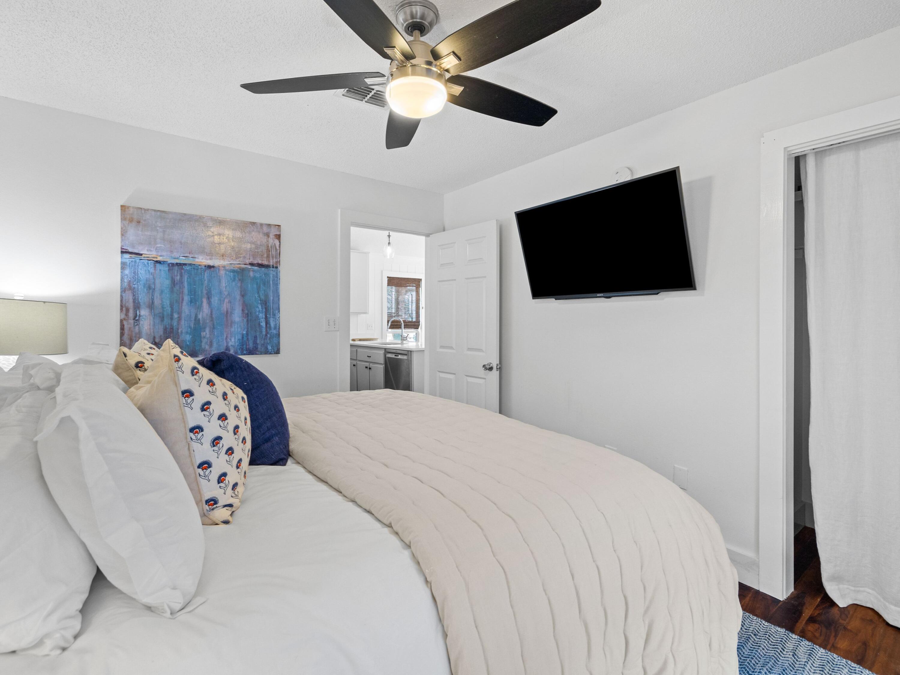 50 Cottage Street Santa Rosa Beach, FL 32459 - Photo 35 of 54 a bedroom with a large bed and a flat screen tv