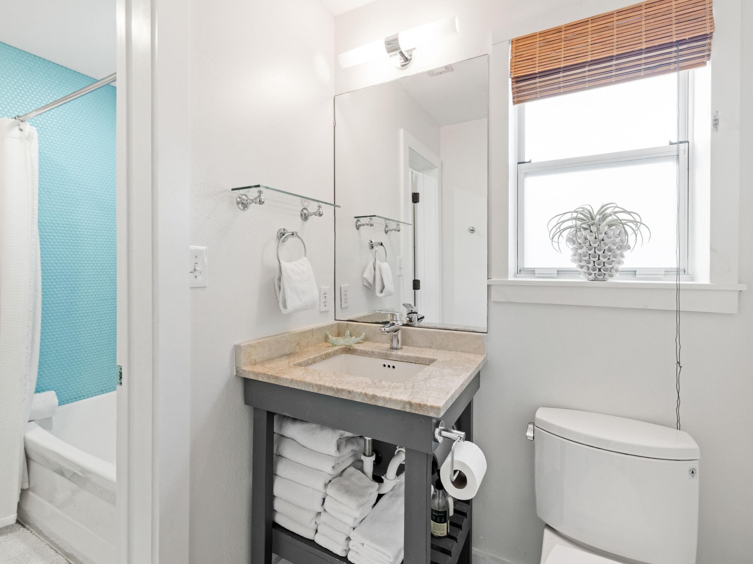 50 Cottage Street Santa Rosa Beach, FL 32459 - Photo 41 of 54 a bathroom with a sink a toilet and shower