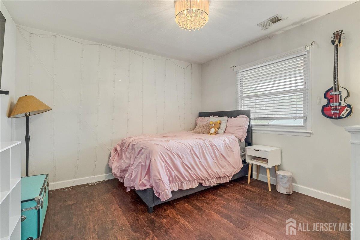59 Appleman Road Somerset, NJ 08873 - Photo 5 of 18 a bedroom with a bed and a lamp