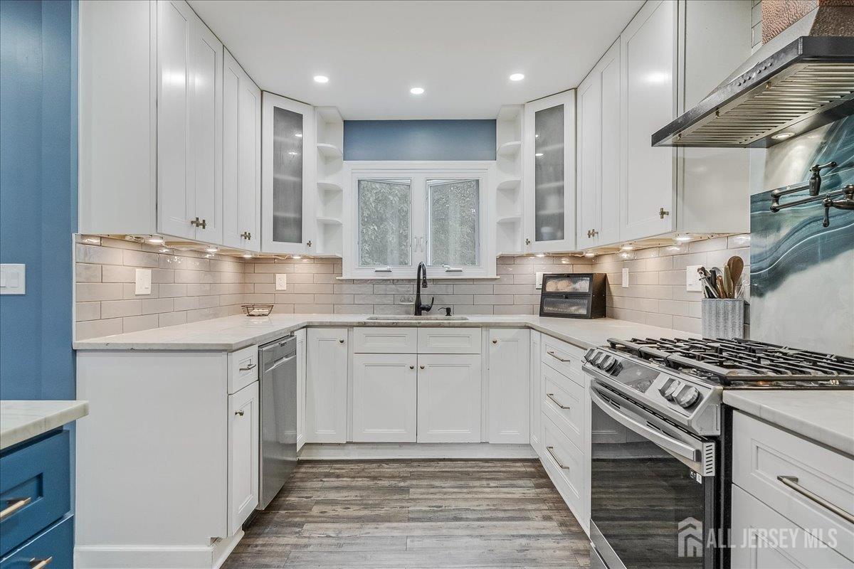 59 Appleman Road Somerset, NJ 08873 - Photo 8 of 18 a kitchen with stainless steel appliances granite countertop a sink stove and cabinets
