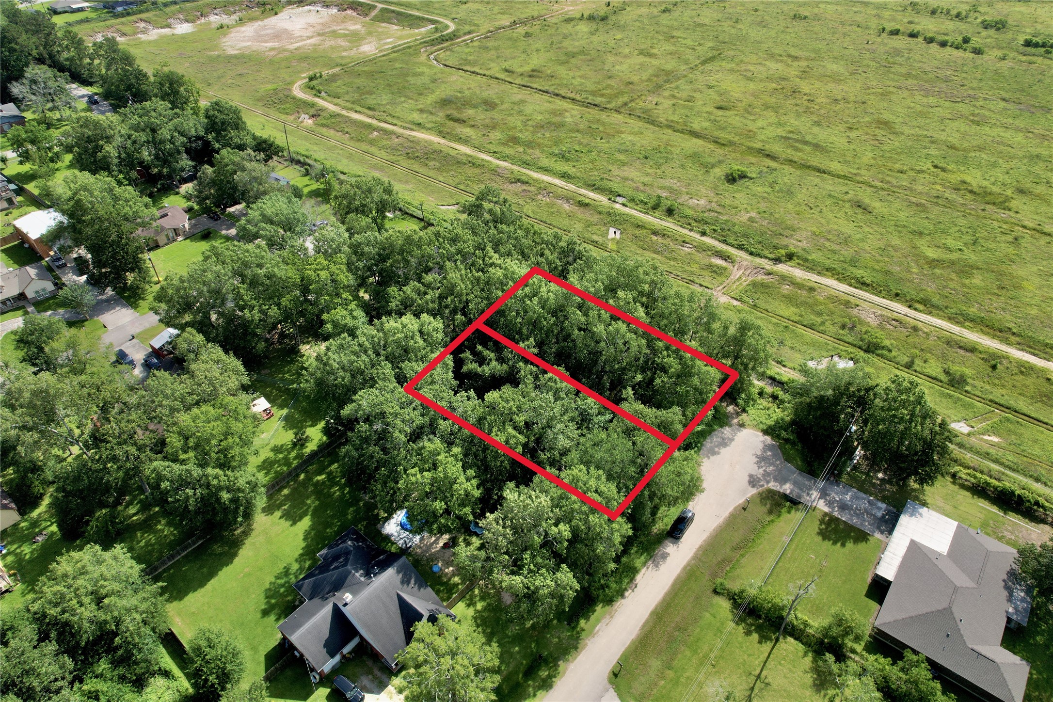 23585-23611 Flower Ridge Porter, TX 77365 - Photo 1 of 5 an aerial view of a houses