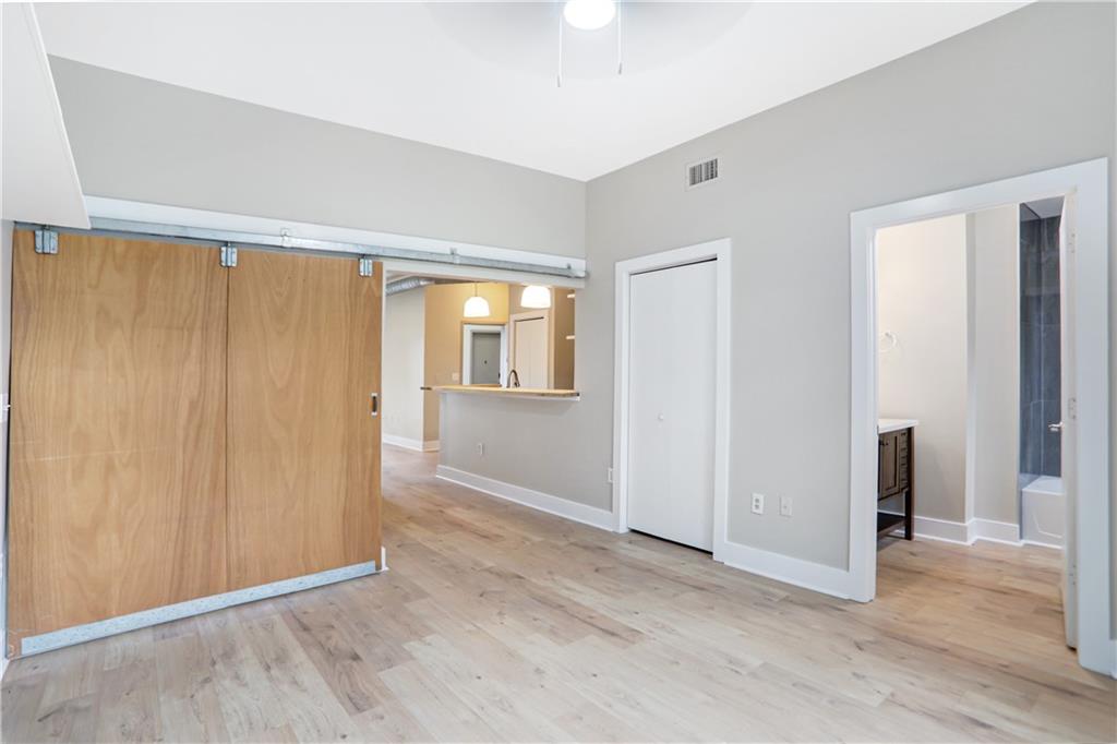502 Pryor Street Southwest, Unit 113 Atlanta, GA 30312 - Photo 12 of 21 an empty room with windows