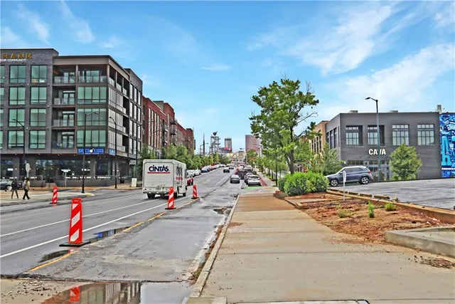 a view of street with tall buildings