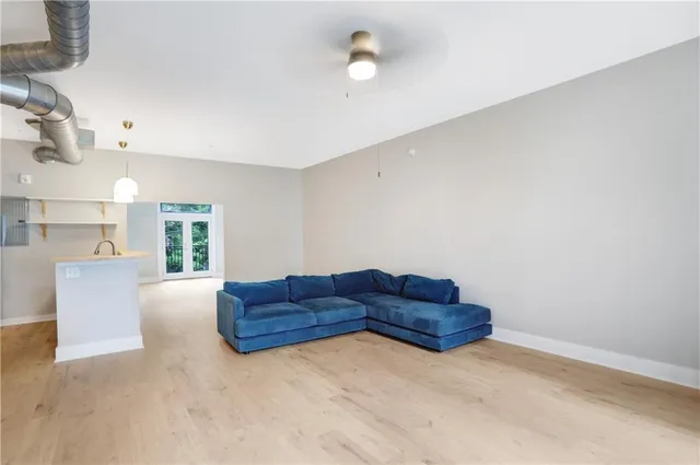 a living room with a couch and a window