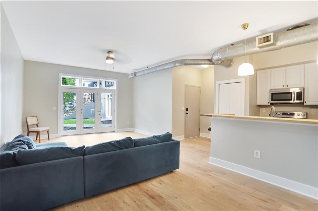 502 Pryor Street Southwest, Unit 113 Atlanta, GA 30312 - Photo 9 of 21 a living room with furniture and a window
