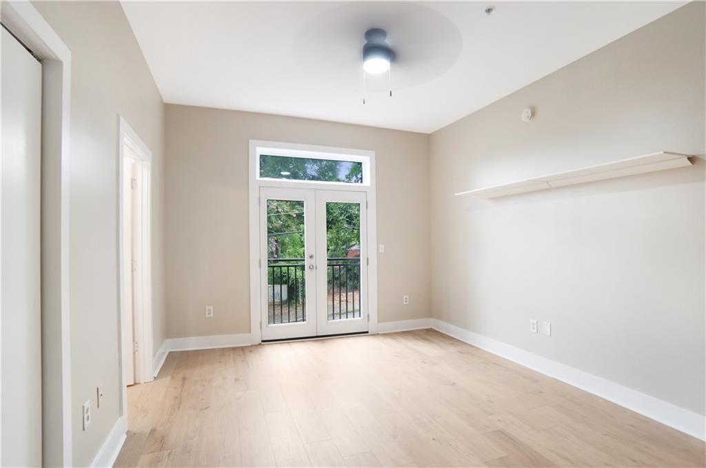 502 Pryor Street Southwest, Unit 113 Atlanta, GA 30312 - Photo 10 of 21 an empty room with windows and closet