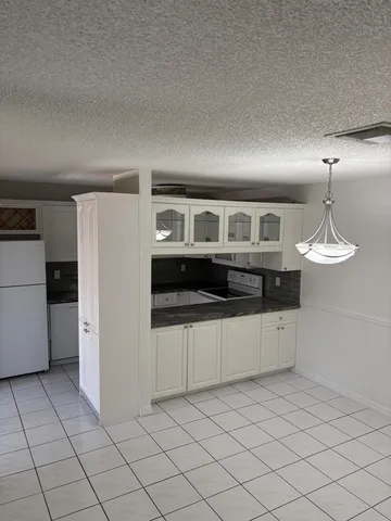 a kitchen with stainless steel appliances a sink and a refrigerator