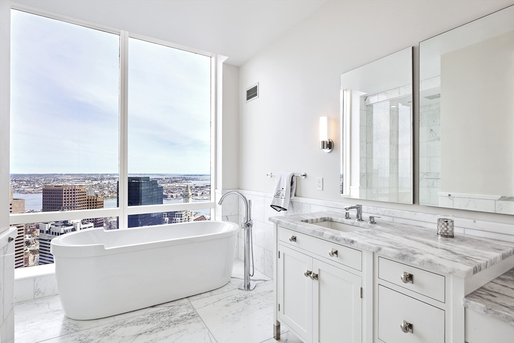 1 Franklin Street, Unit PH1B Boston, MA 02110 - Photo 19 of 42 a view of living room with granite countertop furniture and a sink