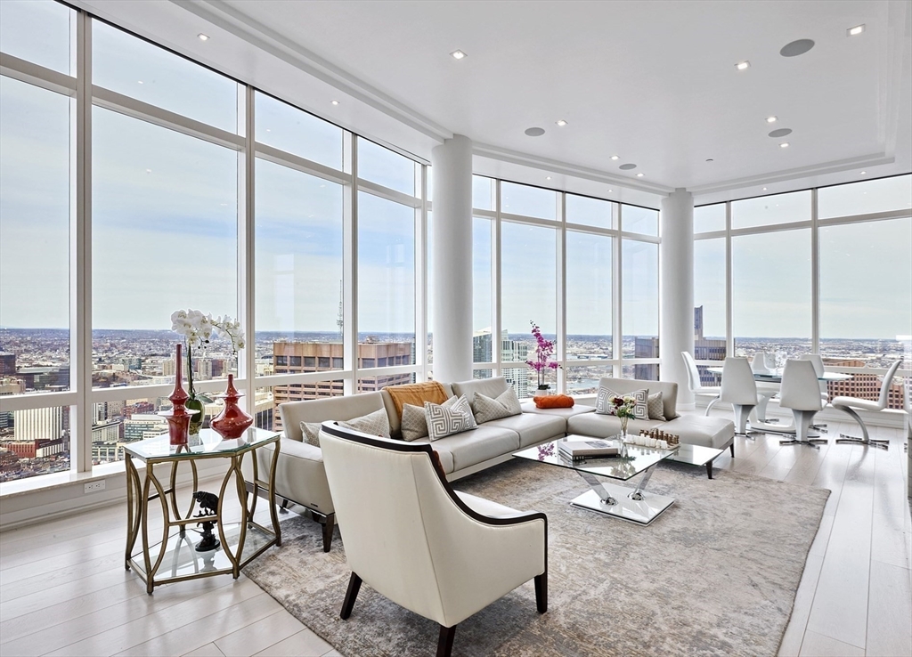 1 Franklin Street, Unit PH1B Boston, MA 02110 - Photo 5 of 42 a living room with furniture and a large window