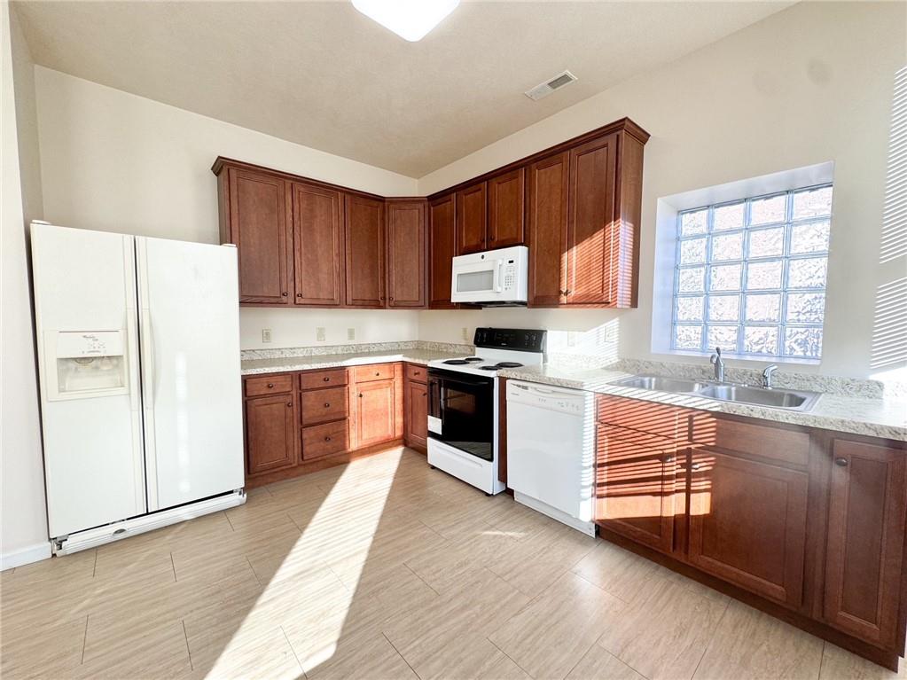 137 North Main Street, Unit D Butler, PA 16001 - Photo 4 of 12 a kitchen with stainless steel appliances a refrigerator sink and cabinets