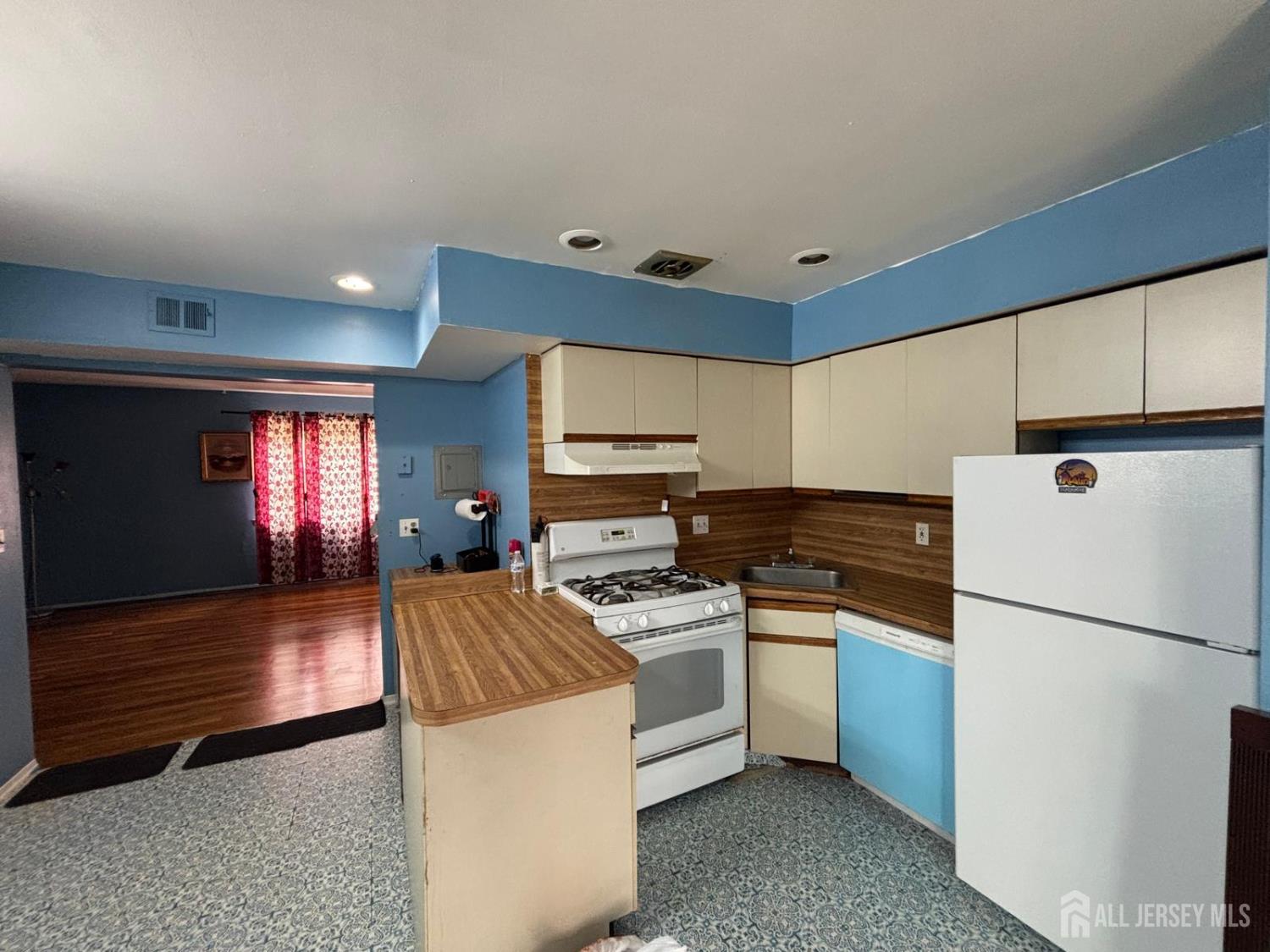 30 Judson Street, Unit 8A Edison, NJ 08837 - Photo 3 of 7 a kitchen with stainless steel appliances granite countertop a sink a stove a refrigerator and a refrigerator