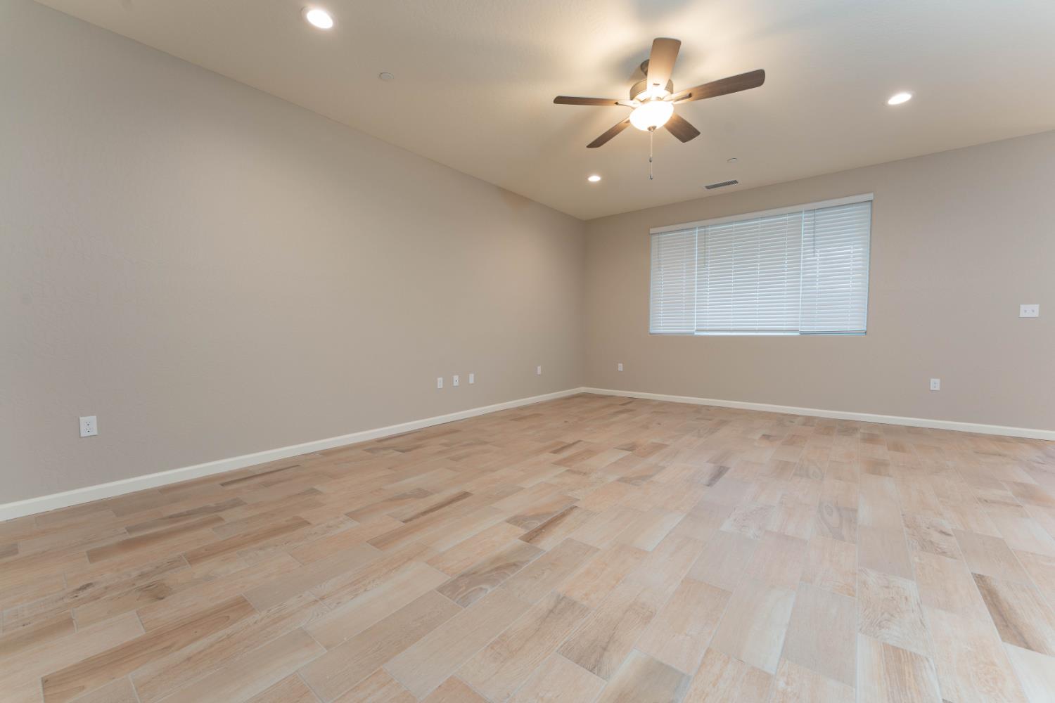 30480 Bellwood Road Visalia, CA 93291 - Photo 3 of 37 an empty room with ceiling fan and window