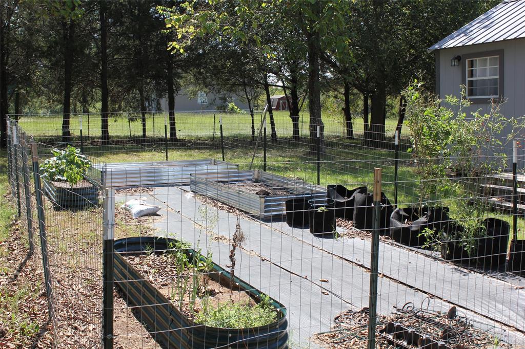 12608 Valverde Loop Terrell, TX 75161 - Photo 24 of 26 a view of a chairs and table in the patio