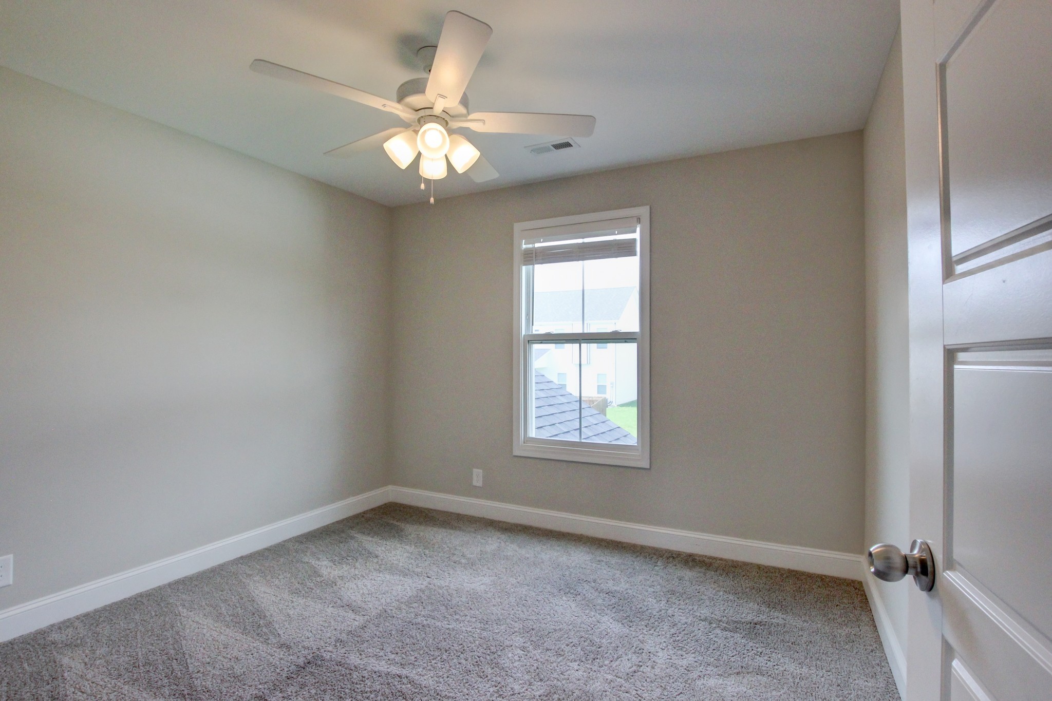 231 King Road Clarksville, TN 37042 - Photo 15 of 26 an empty room with windows and fan