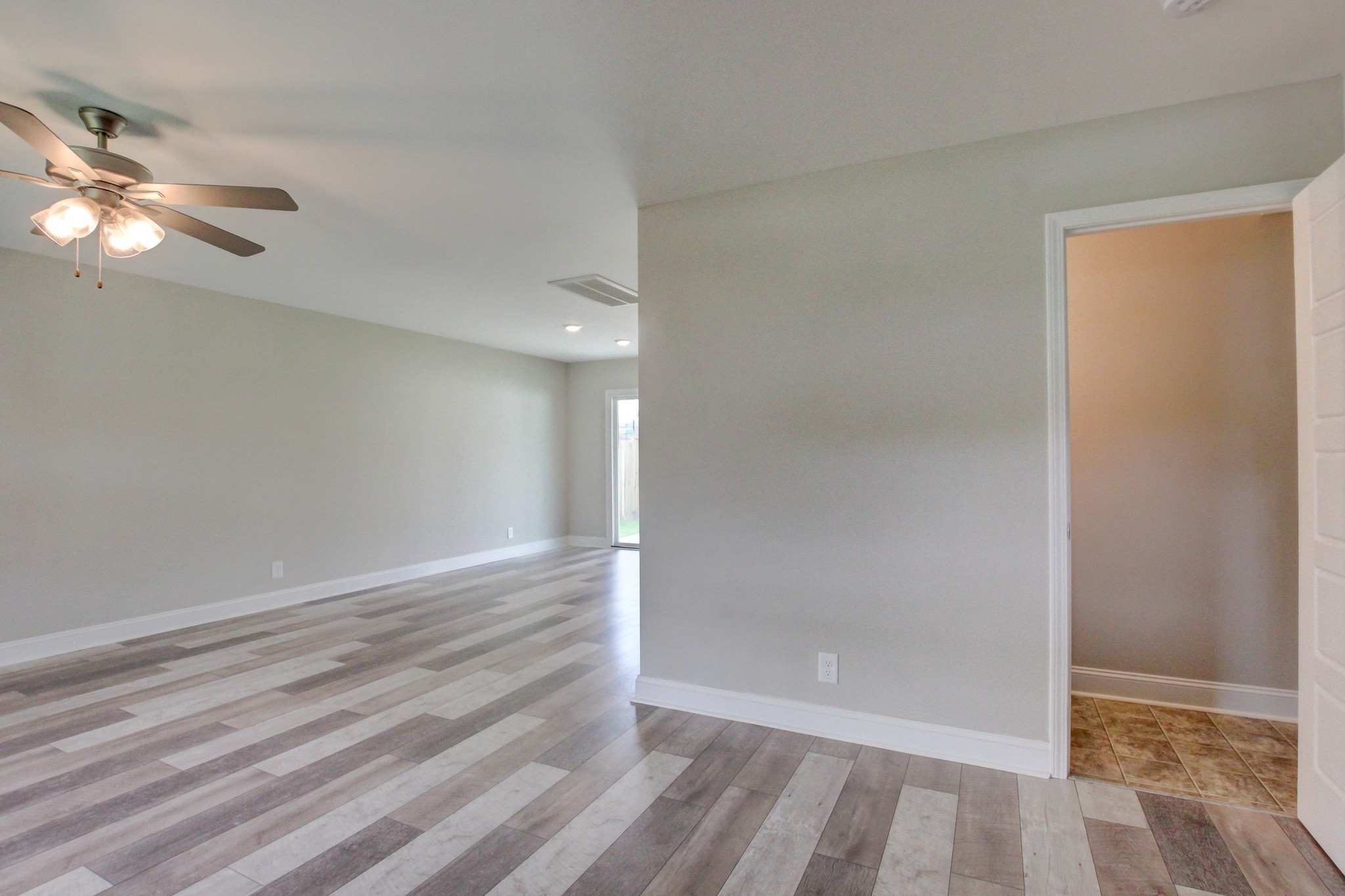 231 King Road Clarksville, TN 37042 - Photo 3 of 26 a view of an empty room with window and chandelier fan