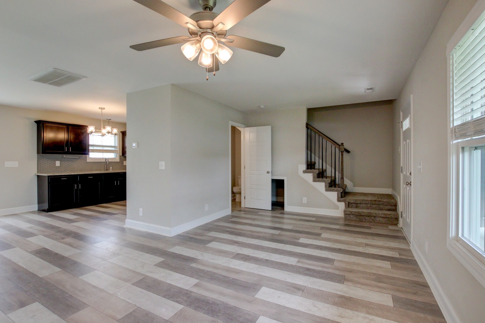 231 King Road Clarksville, TN 37042 - Photo 4 of 26 wooden floor in an empty room with a window