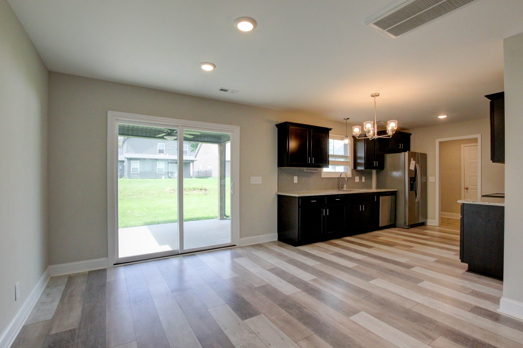 231 King Road Clarksville, TN 37042 - Photo 6 of 26 a kitchen with kitchen island granite countertop a sink counter top space and stainless steel appliances
