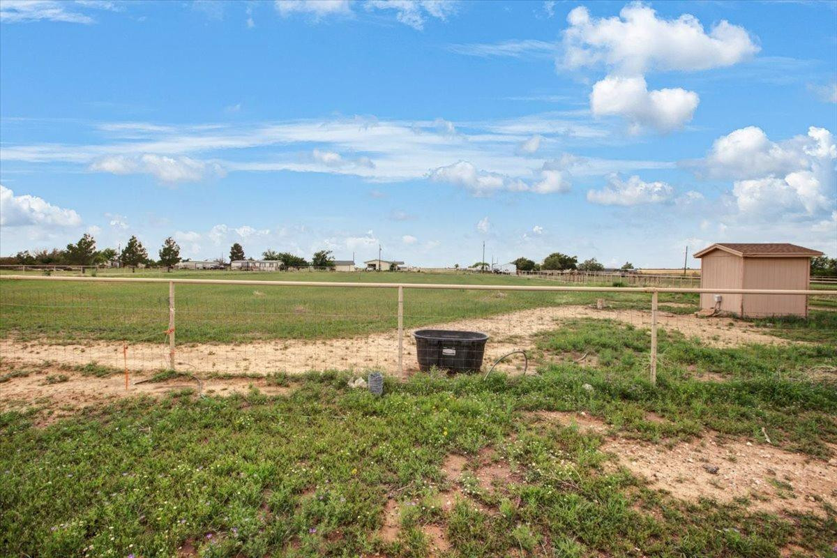 1703 Owl Road Lubbock, TX 79407 - Photo 26 of 33 a view of a lake with a big yard