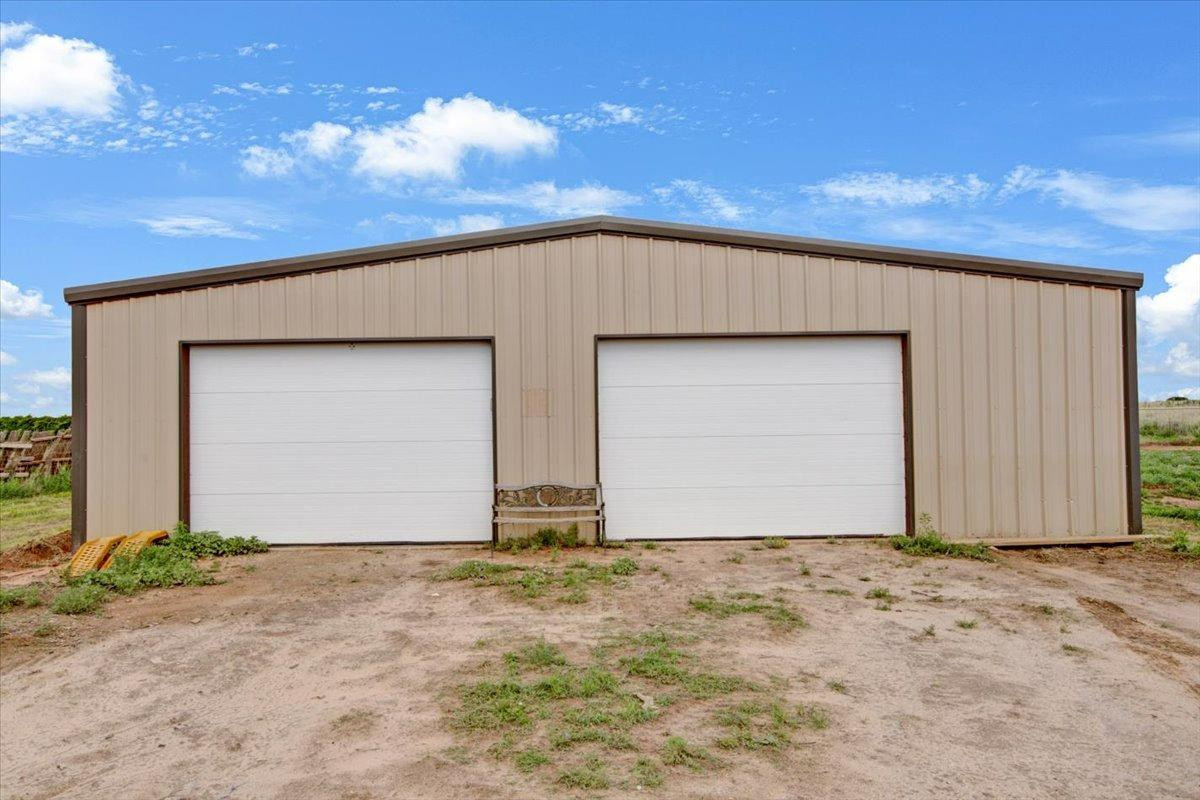 1703 Owl Road Lubbock, TX 79407 - Photo 30 of 33 a front view of house with garage