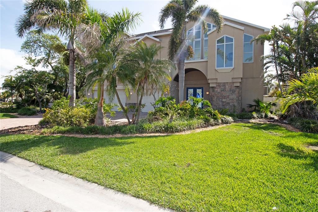 a front view of a house with garden