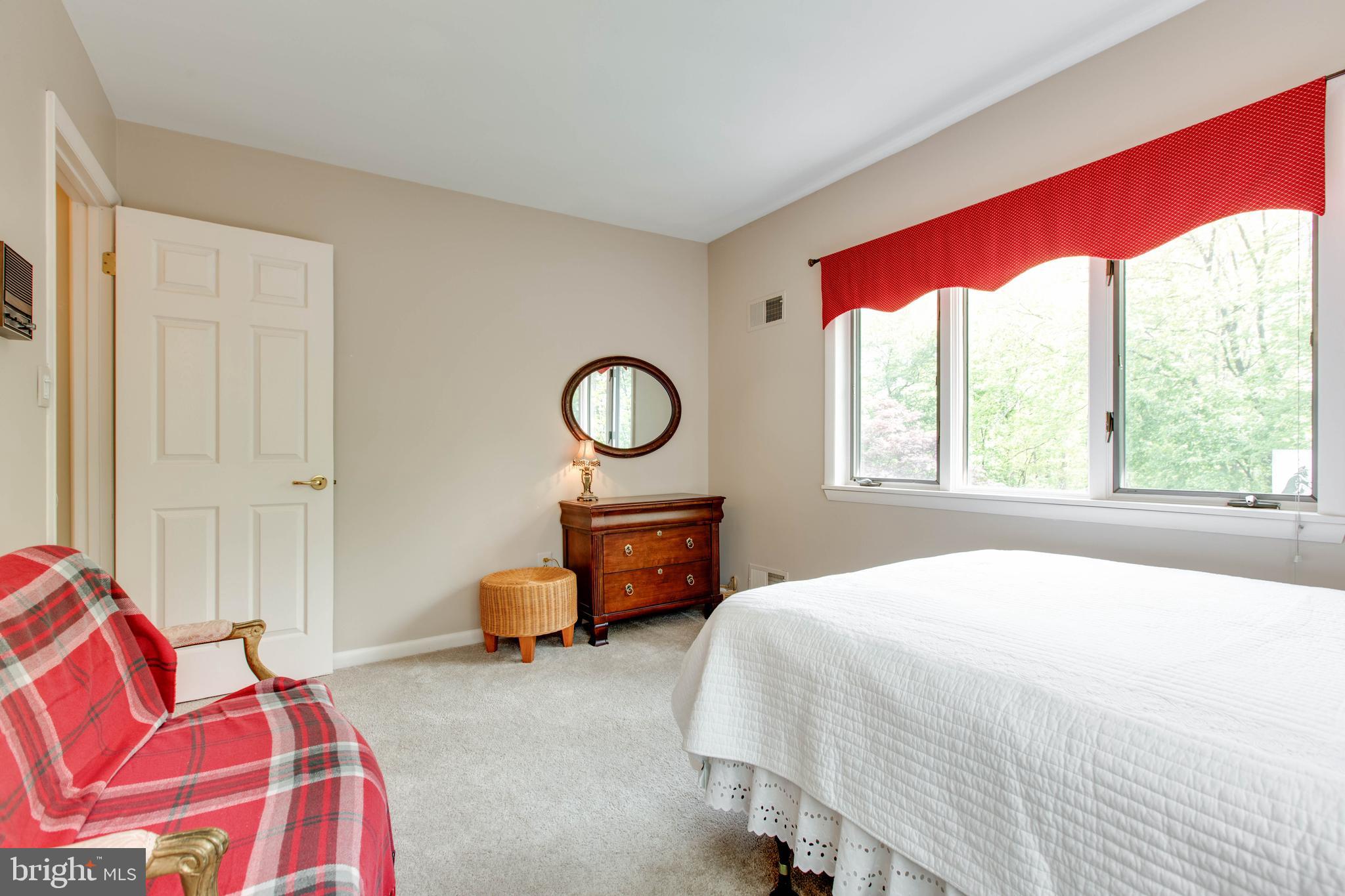 5519 Woodbine Road Sykesville, MD 21784 - Photo 26 of 69 a bedroom with a bed and a large window