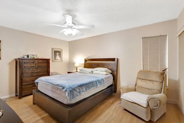 a bedroom with a bed and furniture