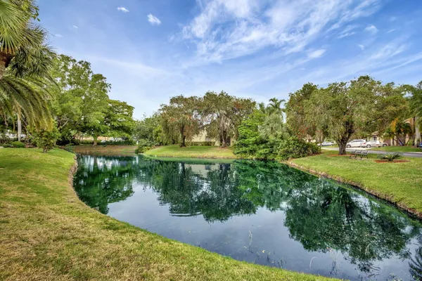 a view of a lake with a yard