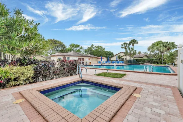 a view of swimming pool with a yard