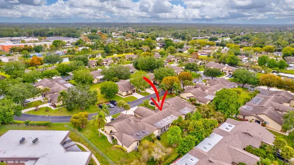 an aerial view of residential houses with outdoor space
