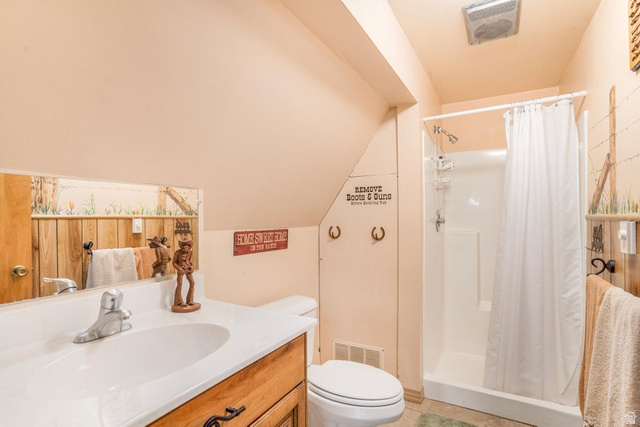 48 South Sage Road Pine Valley, UT 84781 - Photo 34 of 61 Bathroom featuring a single vanity with an integrated sink, shower stall, and sloped ceiling