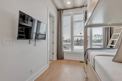 a view of bedroom with window and walk in closet