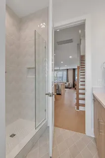 a view of kitchen with a sink and a mirror