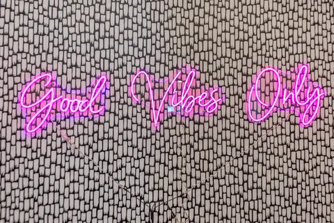 a bedroom with a bed lamp and a large window