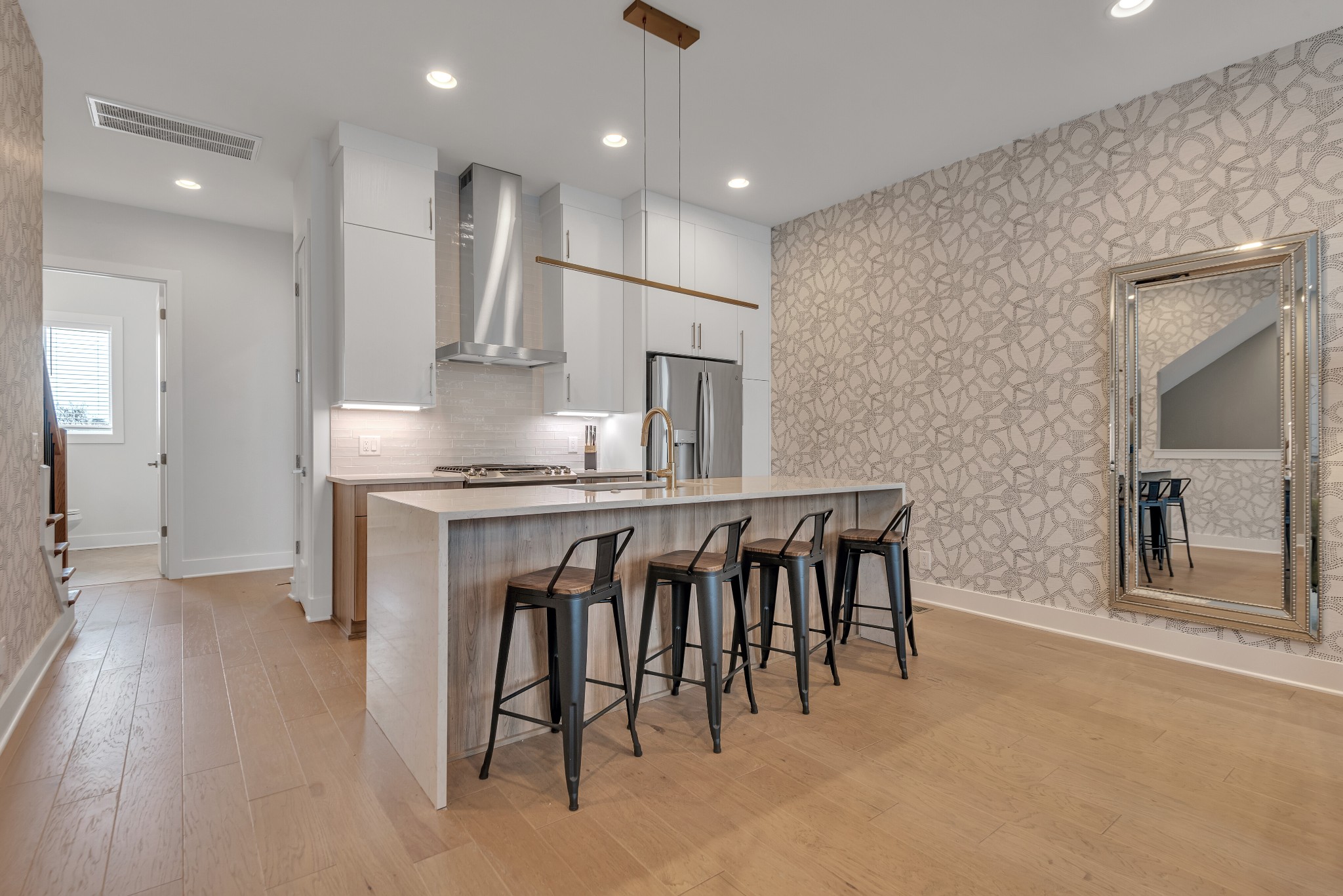 2176 Carson Street, Unit 4 Nashville, TN 37211 - Photo 6 of 45 an open kitchen with refrigerator and wooden floor